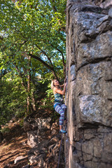 girl climber on a rock.