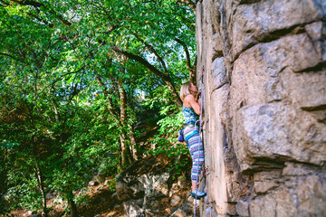 girl climber on a rock.