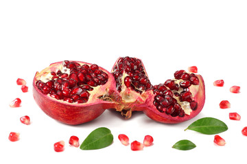 pomegranate fruit with green leaves isolated on a white background