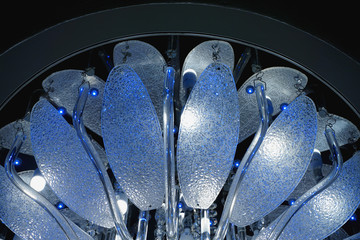 Close up view to soviet luster in black background. Detailed glass sparkles blue lustre 