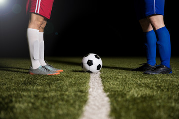 Legs of soccer players before starting a match