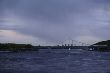 Bridge construction with reflection in river Dnieper, Kiev, Ukraine. Dnipro, Kyiv. 