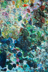 textural multicolored palette of a background of paints made by a brush