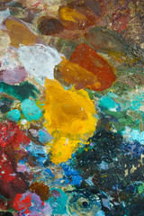textural multicolored palette of a background of paints made by a brush