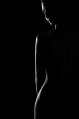 black and white female body in back light art photography - 195057402