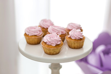 candy bar decorated by delicious sweet buffet with cupcakes and other desserts/candies,happy birthday concept
