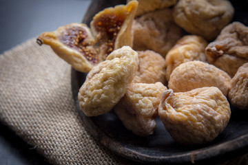 dry figs in rustic wooden bowl dry fruits
