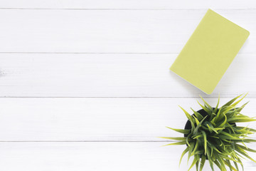Minimal work space - Creative flat lay photo of workspace desk. White office desk wooden table background with mock up notebooks and plant. Top view with copy space, flat lay photography