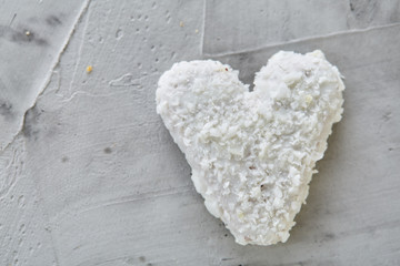 Coconat biscuits arranged in pattern on light textured background, close-up, shallow depth of field, selective focus.