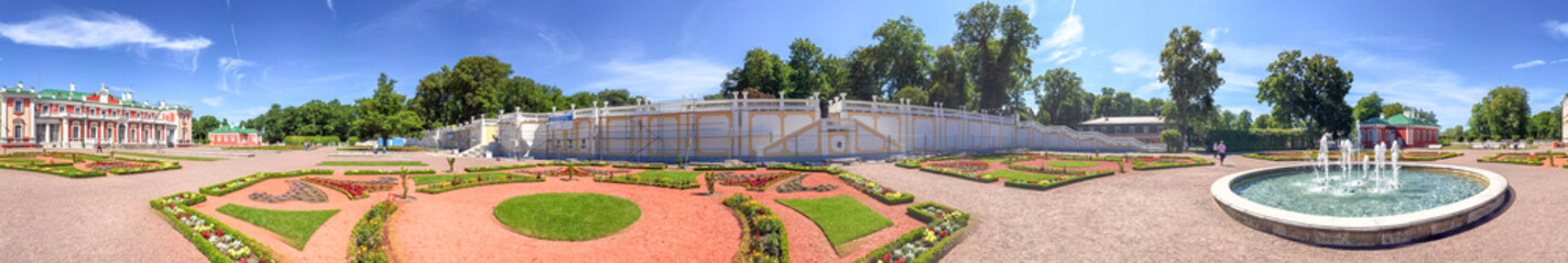 TALLINN, ESTONIA - JULY 15, 2017: Tourists visit Kadriorg Castle. Tallinn attracts 10 million visitors annually