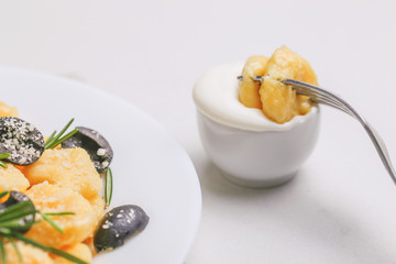 Italian Gnocchi with cream sauce, olives and rosemary