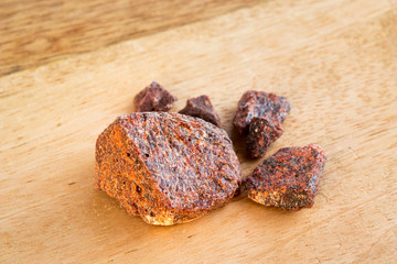 Croton lechleri (sangre de drago) resin on a wooden background
