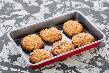 Fresh baked biscuits on a cookie sheet, top view, close-up, selective focus, shallow depth of field.