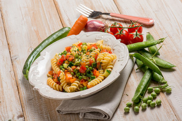 pasta with green peas zucchinis fresh tomatoes and carrot