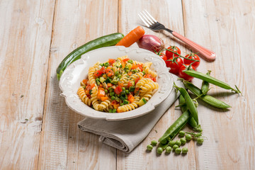 pasta with green peas zucchinis fresh tomatoes and carrot