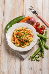 pasta with green peas zucchinis fresh tomatoes and carrot