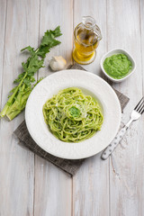 spaghetti with turnip top pesto and parmesan cheese