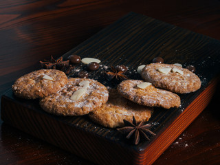 cookies and spices on a dark kitchen board