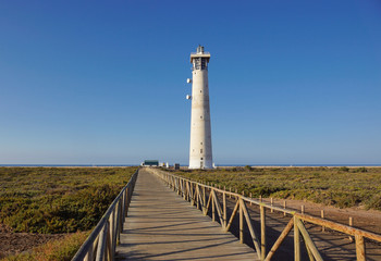 Lighthouse on Morro Jable beach on Jandia peninsula in sunrise light, Fuerteventura, Canary Islands, Spain