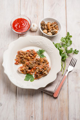 veal escalope with boletus and tomatoes sauce