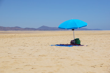 Empty Beach Umbrella in the Desert. Parasol in the desert