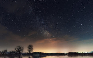 Milky Way over the lake. Milky Way galaxy over the Dojran Lake, FYR Macedonia. The night sky is astronomically accurate.