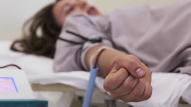 Blood donator donates blood in the hospital
