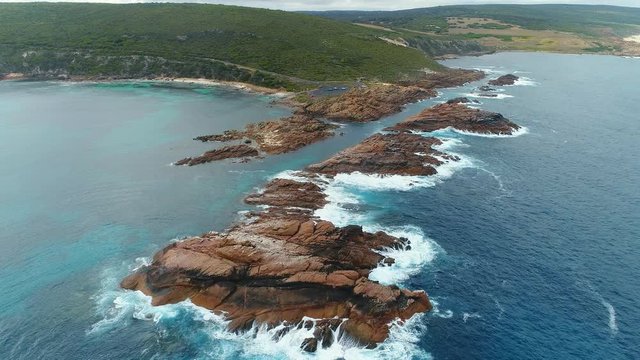 Aerial view of Canal Rocks, picturesque rocks formations protruding above crystal clear waters of Southern Ocean, Western Australia from above, 4k UHD