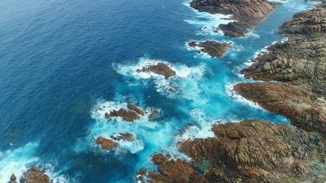 Aerial view of Canal Rocks, picturesque rocks formations protruding above crystal clear waters of Southern Ocean, Western Australia from above, 4k UHD
