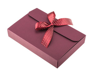 Dark red gift box with polka dot bow isolated on white background