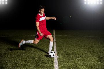 Player starting the soccer game with kick off