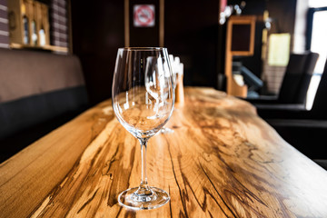 Empty wine glasses on slab table in restaurant