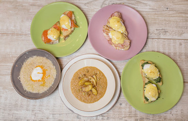 Healthy breakfast - three kinds of toast: with bacon and poached egg, with fish and egg poached, with bacon and poached egg, and two kinds of porridge: oatmeal pike and pike with sliced apples and