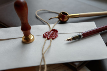 Fountain pen and old notarial wax seal on document, closeup - obrazy, fototapety, plakaty