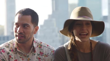 Friends Visiting New York With Manhattan Skyline In Background