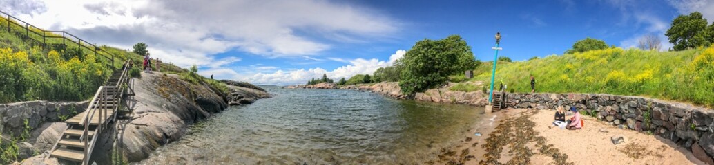 HELSINKI, FINLAND - JULY 4, 2017: Tourists visit Suomenlinna Park. Helsinki attracts 5 million tourists annually