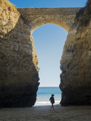 walking through a stonebridge in Lagos- Algarve