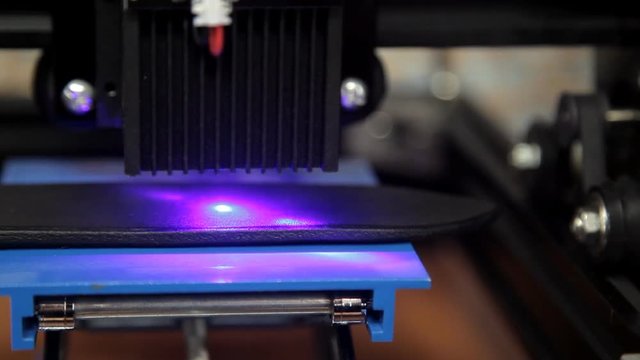 Laser engraving of a leather belt in the workshop