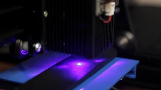 Laser engraving of a leather belt in the workshop