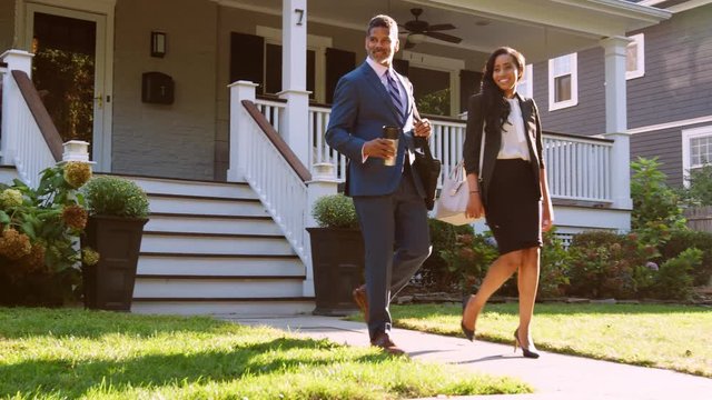 Business Couple With Son Leaving House For Work And School