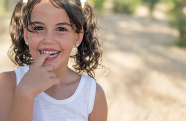 little girl biting her finger