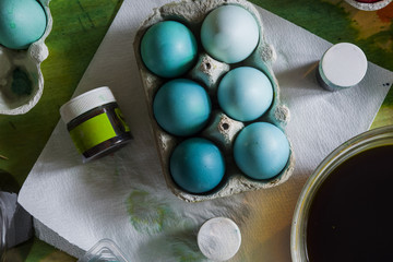 Packages with Dyed eggs for Easter holidays, colored  with red,blue,green and pink tint inside...