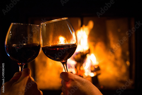 Couple Holding Pair Of Glasses With Wine At Fire Pit Stock Photo