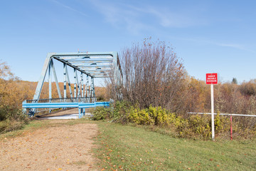 Fototapeta na wymiar abandoned blue steel bridge