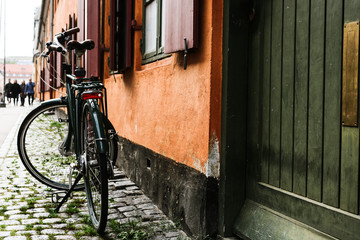 Bicycle near the orange wall of old building in Copenhagen, Denmark. Copenhagen style, Denmark bicycle, european street 