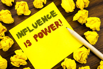 Word, writing Influence Is Power. Business concept for Persuasion Strategy Written on sticky note...