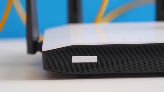 Wireless Wi-Fi Router Is On The White Table