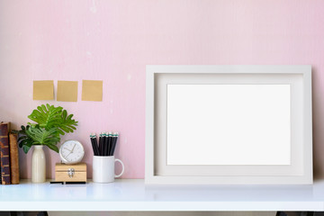 Mockup white poster frame, workspace and supplies.