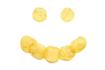 Creative concept with potato chips. The face of a merry clown. Beautiful smile. Food. Flat lay, top view