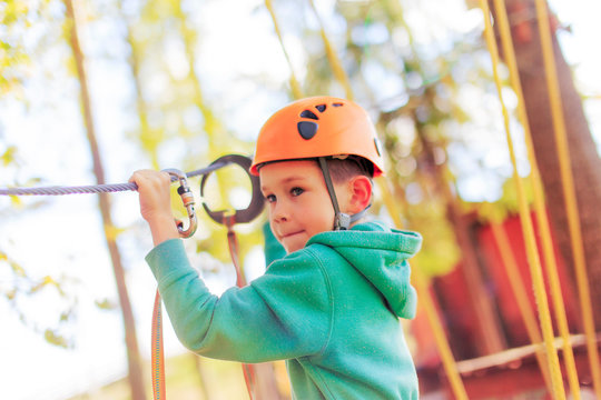 Boy Going On A Jungle Zip Line Adventure. Selective Focus